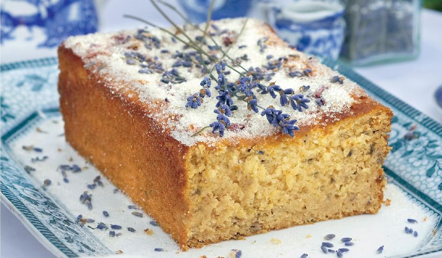 Golden honey lavender loaf cake with dried lavender sprigs on top